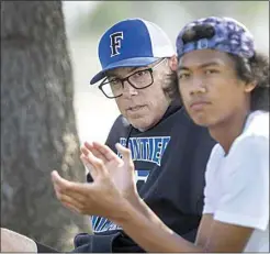  ?? ROD THORNBURG / FOR THE CALIFORNIA­N ?? Frontier interim boys tennis coach Scott Hernandez and player Jameson Jose watch the Titans play Thursday at Bakersfiel­d Christian.