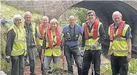  ??  ?? ●» David Rutley MP with members of the Macclesfie­ld Canal Adoption Group.