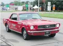  ?? FRED BOTTCHER / DRIVING ?? The author cruises Woodward Avenue in a 1966 Mustang.