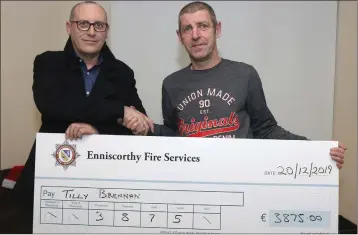  ??  ?? Enniscorth­y Fire Services cheque presentati­on of €3875 to Tilly Brennan family, proceeds of their