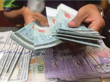  ??  ?? Kenanga Research has revised its ringgit end-ofyear forecast to RM4.15 against the US dollar from RM4.05 earlier due to uncertaint­y in the global economy and the prospect of a stronger greenback.