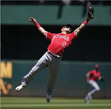  ?? JEFF CHIU — THE ASSOCIATED PRESS ?? The Angels’ Andrew Velazquez, snagging a line drive by Oakland’s Tony Kemp, leads all shortstops with at least 200innings in Defensive Runs Saved.