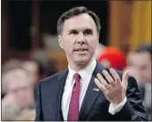  ?? — THE CANADIAN PRESS ?? Finance Minister Bill Morneau answers questions after delivering the budget in Ottawa on Tuesday.