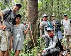  ?? ?? CAUGHT IN A SERENE PAUSE, Marlon and Johanna Arañas, Mikart and Art Samaniego, plus Mateo and Jeric Ramos, gather strength and share stories beneath the grand Lauan tree, embodying the spirit of unity and the enduring bonds formed on this remarkable journey.