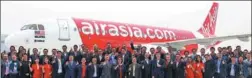  ?? PROVIDED TO CHINA DAILY ?? Officials from Airbus and Air Asia celebrate after the delivery ceremony for the A320neo aircraft in