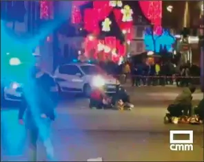  ?? AP ?? In this image made from video provided by CMM, people lie on the ground after a shooting at a Christmas market in Strasbourg, France, on Tuesday.