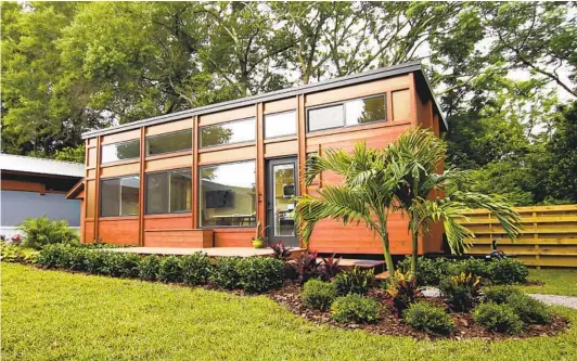  ?? DAVID PETERSON PHOTOS ?? Judie Clark’s tiny house at Tampa Bay Village is roughly 400 square feet. The retired bus tour director downsized from a 1,700-square-foot house in Tampa, Fla.