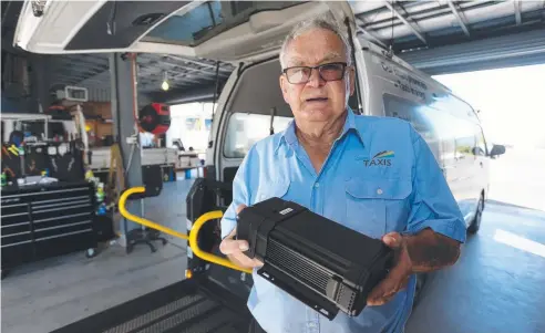  ?? Picture: STEWART McLEAN ?? OUT OF POCKET: Taxi owner Graeme Lawler holds a digital video recording box awaiting approval.