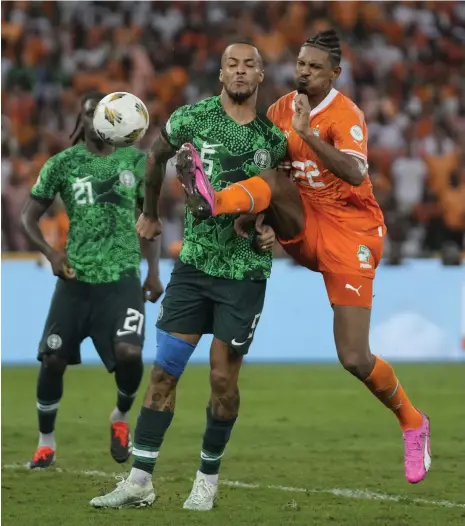  ?? AP ?? Ivory Coast‘s Sebastien Haller, right, scores his side’s late winner against Nigeria in the Africa Cup of Nations final in Abidjan