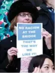  ?? SEAN DEMPSEY/AFP/GETTY IMAGES ?? A Chelsea fan hold an anti-racism sign during a match against Burnley at Stamford Bridge on Saturday.