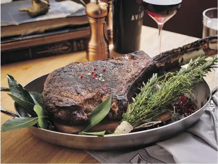 ??  ?? The ‘show stopper’ 50-ounce tomahawk steak at the restaurant.
