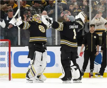  ?? RICH GAGNON / GETTY IMAGES ?? Bruins goalies Linus Ullmark, left, and Jeremy Swayman both finished in the top 10 in save percentage this regular season, giving Boston an edge between the pipes.