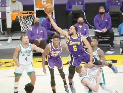  ?? USA Today Sports ?? Los Angeles Lakers’ Talen Horton-tucker (5) moves to the basket against Boston Celtics’ Moritz Wagner (20) during the second half at Staples Center. —