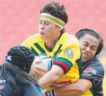  ?? ROUGH STUFF: Heather Ballinger in action during an Australian Jillaroos Test against the Kiwi Ferns. ??