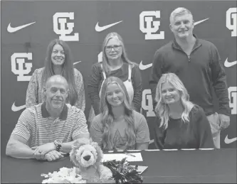  ?? Scott Herpst ?? Tim and Meredith Peterson were among those on hand to watch Gordon Lee senior cheerleade­r Gracelyn Peterson sign to continue her career at Wallace State (Ala.). Also at the ceremony was Gordon Lee head cheer coach Kelley Whitman, assistant cheer coach Stacy Smith and Wallace State head coach Kevin Yates.