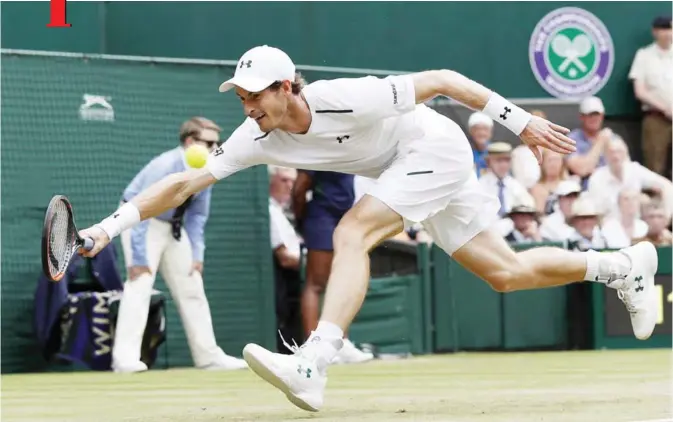  ??  ?? LONDON: Britain’s Andy Murray returns against France’s Benoit Paire during their men’s singles fourth round match on the seventh day of the 2017 Wimbledon Championsh­ips at The All England Lawn Tennis Club in Wimbledon, southwest London, yesterday. — AFP
