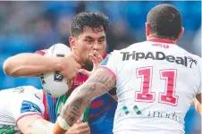  ?? Picture: GETTY ?? TOUGH GOING: Newcastle’s Herman Ese’ese takes the attack to St George Illawarra in Newcastle on Sunday.