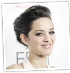  ??  ?? Marion Cotillard smiles at the Rust and Bone gala screening during
AFI Fest at Grauman’s Chinese Theater in Hollywood this week.