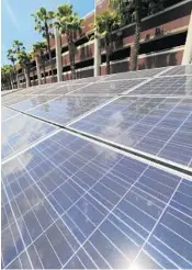  ??  ?? UCF has taken advantage of campus spaces suitable for solar panels — like this one at a parking garage.