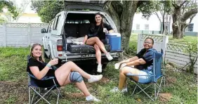  ?? ?? LAID BACK: Megan Stock, Tarryn Stock and Sena Letsie chill under the trees.