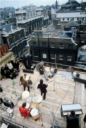  ?? Photograph: Ethan A Russell/Apple Corps Ltd ?? ‘I think it’s a bit of an imposition to absolutely disrupt all the business in this area’ … the gig on the roof of Apple Corps.