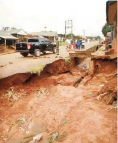  ?? PHOTO: ?? A part of Otukpo Road in Ankpa, Kogi State, after it was damaged by flood Umoru Faruk Salifu