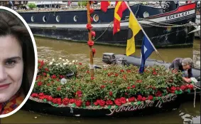  ??  ?? Pride: Lejla and Cuillin Cox make a barge journey yesterday with father Brendan and inspect a flower-laden floating tribute to mum Jo, inset
