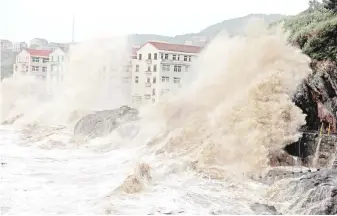  ??  ?? Waves caused by typhoon Maria batter the coast near Wenling, east China’s Zhejiang province. — AFP photo