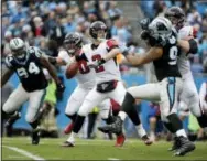  ?? BOB LEVERONE - THE ASSOCIATED PRESS ?? Atlanta Falcons’ QB Matt Ryan (2) looks to pass against the Carolina Panthers in the second half of an NFL football game in Charlotte, N.C., Saturday. Atlanta won 33-16.