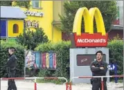  ?? AFP ?? Policemen stand in front of a McDonald’s restaurant on Saturday in Munich where the shooting took place.