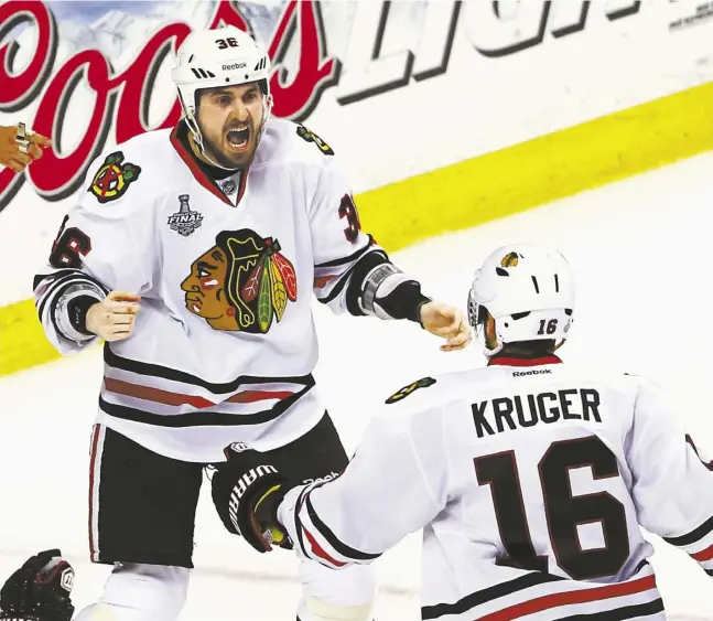  ?? ELSA / GETTY IMAGES ?? Dave Bolland, left, notched the Stanley Cup winning goal for the Blackhawks just 17 seconds after Bryan Bickell scored to tie the game.