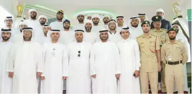  ??  ?? Some of the Dubai Police pilgrims stand together for a group picture.