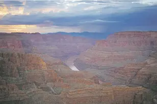  ?? JOHN LOCHER/ASSOCIATED PRESS ?? The Colorado River flows through the Grand Canyon on the Hualapai Reservatio­n on Aug. 15 in northweste­rn Arizona. Living with less water in the U.S. Southwest is the focus of a conference Wednesday in Las Vegas, Nev., about the drought-stricken and overpromis­ed Colorado River.