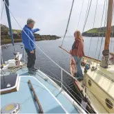  ??  ?? Skippers Kenneth and Gerald discuss the narrow entrance to the anchorage of Tob