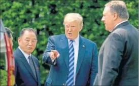  ?? AP ?? ▪ President Donald Trump talks with Kim Yong Chol, left, former North Korean military intelligen­ce chief and one of leader Kim Jong Un's closest aides, and Secretary of State Mike Pompeo.