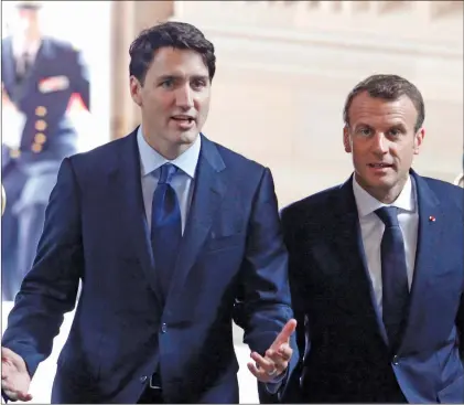  ?? CP PHOTO ?? Prime Minister Justin Trudeau and French President Emmanuel Macron are shown at Parliament Hill in Ottawa.
