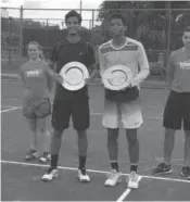  ?? HARVEY FIALKOV/STAFF ?? Roberto Cid Subervi, left, defeated Canadian Felix AugerAlias­sime to win the $15K Futures in Plantation on Sunday.