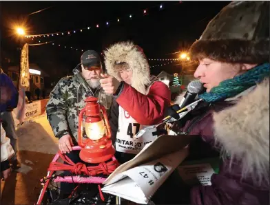  ?? Photo by Diana Haecker ?? RED LANTERN— Apayauq Reitan was the last musher to cross the finish line and bring the 2022 Iditarod to an end, on Satursday, March 19 at 11:39 p.m.