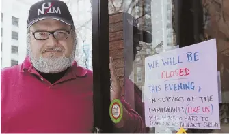  ?? STAFF PHOTO BY ANGELA ROWLINGS ?? SUPPORTING IMMIGRANTS: Charles Draghi, owner of Erbaluce Restaurant in Bay Village, closed his business yesterday in solidarity with the national “Day Without Immigrants” protest.