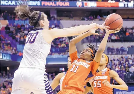  ?? AJ MAST/THE ASSOCIATED PRESS ?? UConn’s Breanna Stewart (30) harasses Syracuse’s Cornelia Fondren (11) in the first half of Tuesday night’s NCAA women’s title game. Stewart, a senior, earned her fourth straight NCAA championsh­ip.