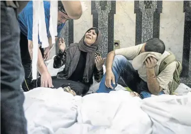  ?? Picture: GETTY IMAGES ?? DAYS OF SORROW: Killed during clashes with Egyptian security forces, a supporter of deposed Egyptian president Mohamed Morsi is mourned by a family member at the Fateh Mosque on Friday