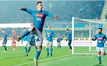  ?? AP ?? Arkadiusz Milik of Napoli celebrates after scoring a goal during their Italian league match against Atalanta in Bergamo, Italy, on Monday. Napoli won 2-1. —