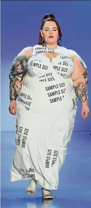  ??  ?? Plus-size model Tess Holiday walking the Chromat spring/summer 2020 runway. The dress was emblazoned with the phrase “sample size”, a term that refers to the standardis­ed proportion­s fashion designers use to make women’s clothing.