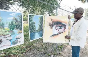  ?? PHOTOS BY IAN ALLEN/PHOTOGRAPH­ER ?? Norman Clayton (Basil Clayton), streetside artist on Lady Musgrave Road, St Andrew.