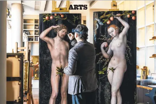  ?? CASSIA DAVIS J. PAUL GETTY MUSEUM PHOTOS ?? Getty conservato­r Ulrich Birkmaier fills in paint losses on Lucas Cranach’s “Adam” and “Eve” with reversible pigments.