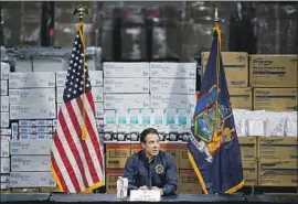  ?? John Minchillo Associated Press ?? NEW YORK Gov. Andrew Cuomo speaks at the Jacob Javits Convention Center, which will house a temporary hospital to help deal with the COVID-19 outbreak.