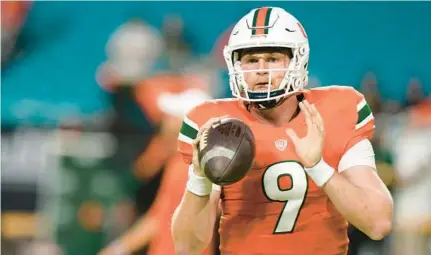  ?? LYNNE SLADKY/AP ?? Miami quarterbac­k Tyler Van Dyke warms up before the Hurricanes’ loss to Florida State on Nov. 5 in Miami Gardens. Van Dyke is expected to play against Pittsburgh on Saturday.