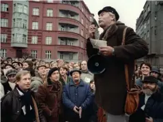  ??  ?? Vaclav Havel (left), a dissident playwright, and Rudolf Batek listen to Ladislav Lis address a crowd in 1988 in Prague (AFP/Getty)