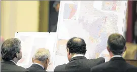  ?? DEBORAH CANNON / AMERICAN-STATESMAN 2011 ?? Members of the Texas House of Representa­tives discuss redistrict­ing maps drawn up by Rep. Trey Martinez Fischer, D-San Antonio, in a 2011 meeting. The maps the Legislatur­e eventually came up with have been contested.