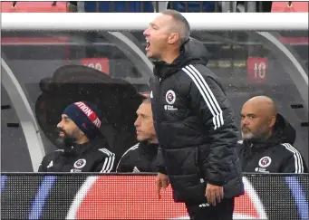  ?? CHRIS CHRISTO — BOSTON HERALD ?? Revolution head coach Caleb Porter calls out to his players during a game against the Chicago Fire earlier this season.